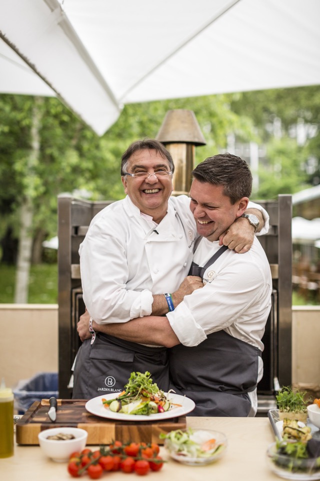 Adam Johnson laughing with Raymond Blanc